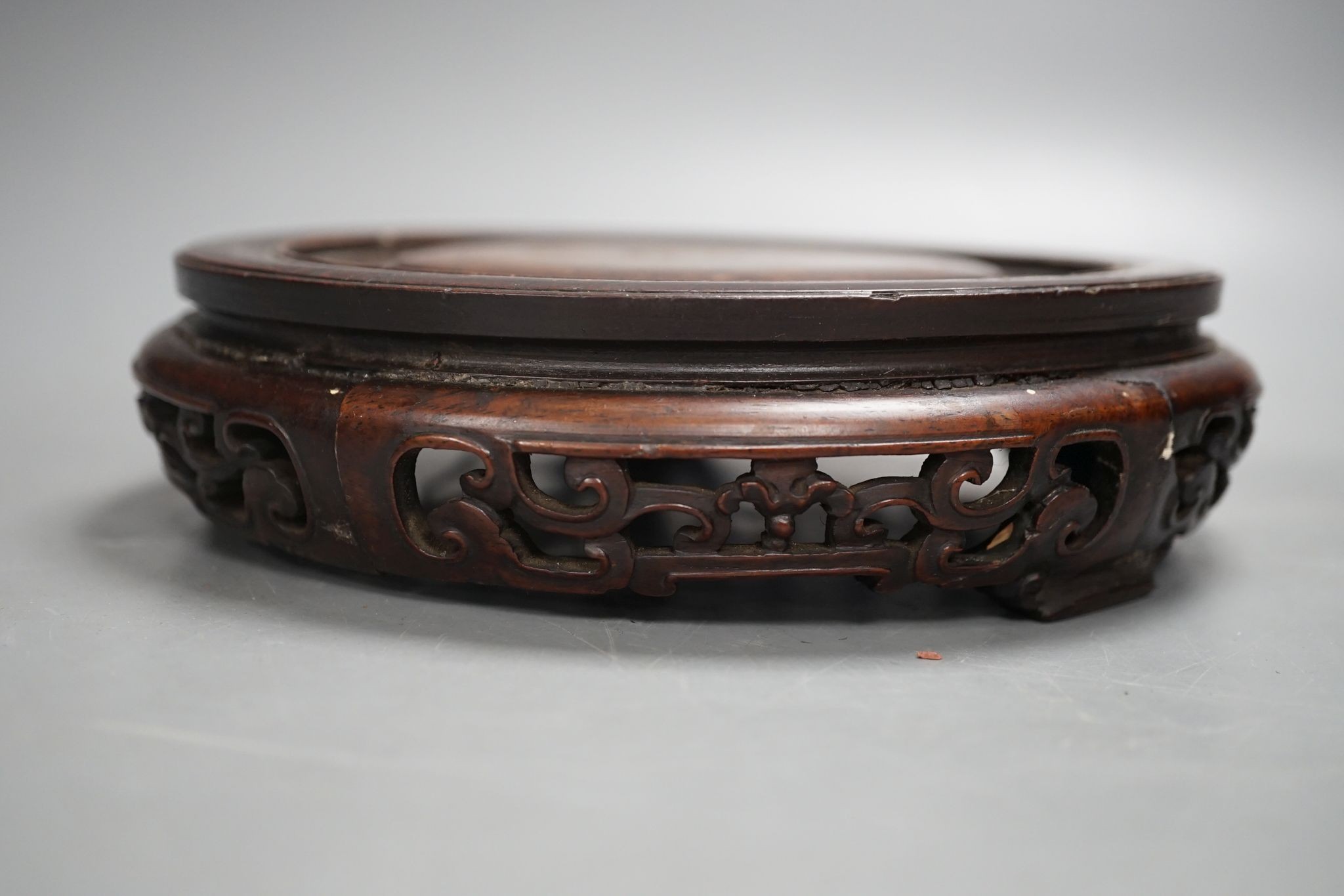 A Chinese carved hardwood stand 19cm